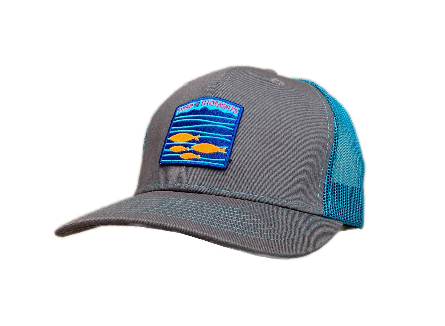 Graphite and turquoise blue trucker cap with embroidered aqua orange and royal blue fish under waves patch